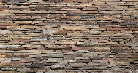 Wall of flat stones