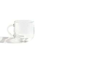 There is a glass cup on a white background.