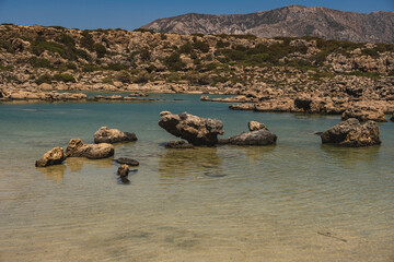 single stones on the sandy coast of the Mediterranean Sea on the island of Crete