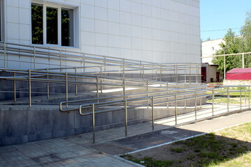 Ramp for people with disabilities with handrails.