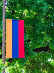armenian flag and green tree leaves in background