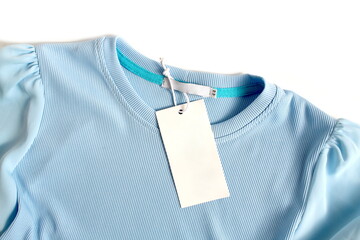 Women's clothing lies with a label on a white background.