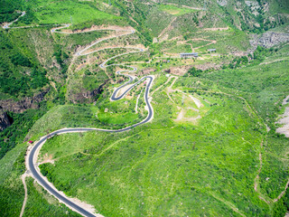 top view of mountain plateau with serpentine road