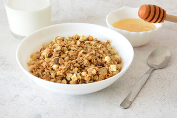 Granola Breakfast with Milk and Honey and spoon