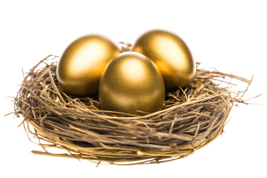 Three golden eggs in nest isolated on a white background - Powered by Adobe