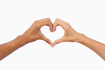 Closeup of an interracial women couple’s hands forming a heart shape. Symbol of LGBTQ+ pride,...