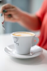 A Serene Moment: Indulging in a Warm Cup of Coffee