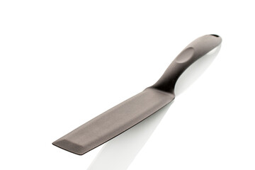 One plastic pancake spatula isolated on white background, close-up.