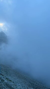 Kyrgyzstan, Ala Archa, Twilight, cloud covers visibility very quickly, cloud floating in the mountains, fog blinds eyes, hiking in the mountains, fog on the peak