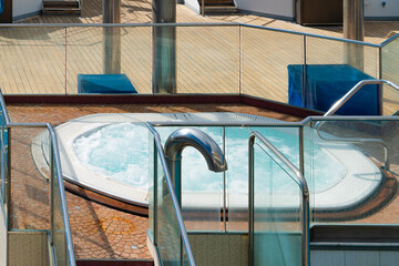 Modern hot tub with bubbling water on cruise ship deck