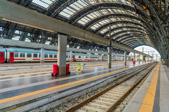 Modern European Railway Station with Arched Roof and Trains