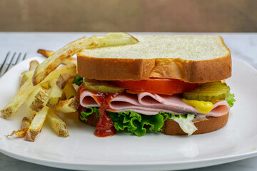 ham sandwich with a side of fries