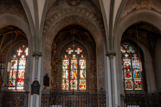 A close-up view of the breathtaking stained-glass windows within the historic Konstanz Minster (Münster unserer Lieben Frau) in Konstanz, Germany