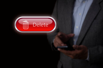 Man pushing the delete button on virtual screen.