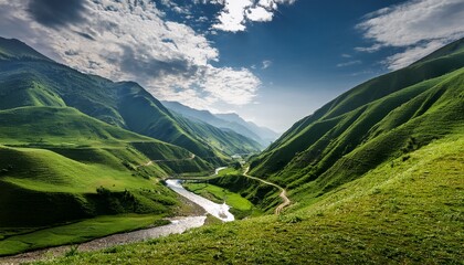 lush green valley with river winding through the mountains