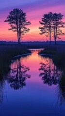Obraz premium Trees are reflected in a small pond at sunset vertical background