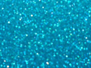 Blue sparkle background. Turquoise glitter background. Turquoise glimmer. Abstract twinkle texture....
