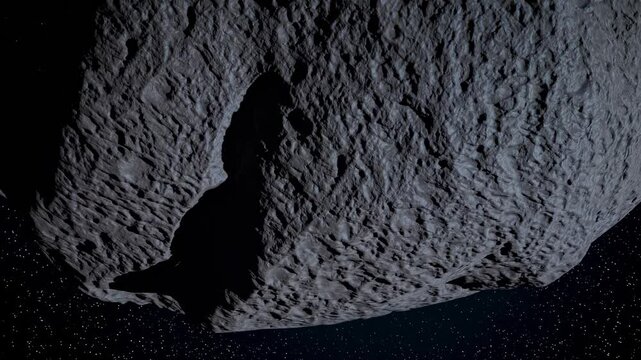 Massive cratered asteroid floating in space with visible surface texture and deep shadows

