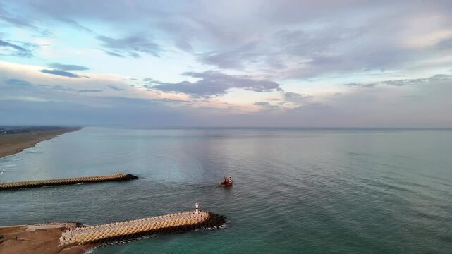 Sakarya Karasu Adapazari Turkiye Turkey High-Angle View of a Coastal Pier at Dawn Dusk. An aerial shot of a coastal pier extending into a calm ocean at sunrise or sunset. 4k ultrahd holiday travel 
