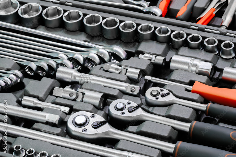 Poster A toolbox with many tools including a wrench. The wrench is silver and has a black handle