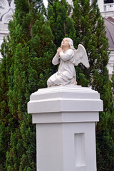 BAGRATIONOVSK, RUSSIA. Sculpture of a kneeling angel in the temple grounds. Kaliningrad region