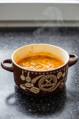 Massaman curry in a clay bowl with handles. Hot spicy Thai dish