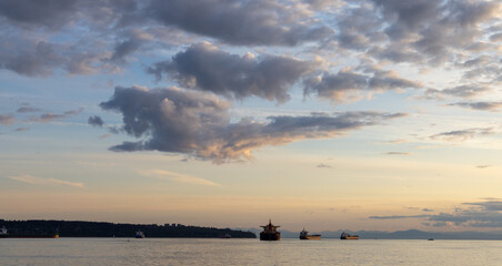Large Ships Anchored Off Stanley Park During a Peaceful Sunset
