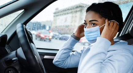 New normal and prevent covid-19 pandemic at work or traveling. Young african american woman taxi...