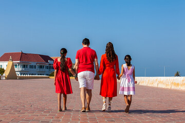 Young family of four traveling together. Family love concept. Travel concept. Cartagena de Indias.
