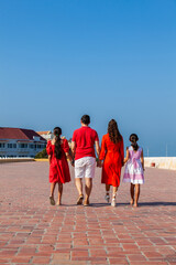 Young family of four traveling together. Family love concept. Travel concept. Cartagena de Indias.