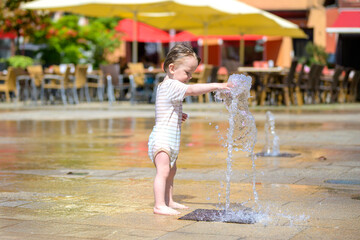 Toddler Playing At Water Fountain