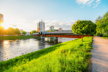 Fototapeta premium Wooden bridge with river in Dolny Kubin in orava region in summer