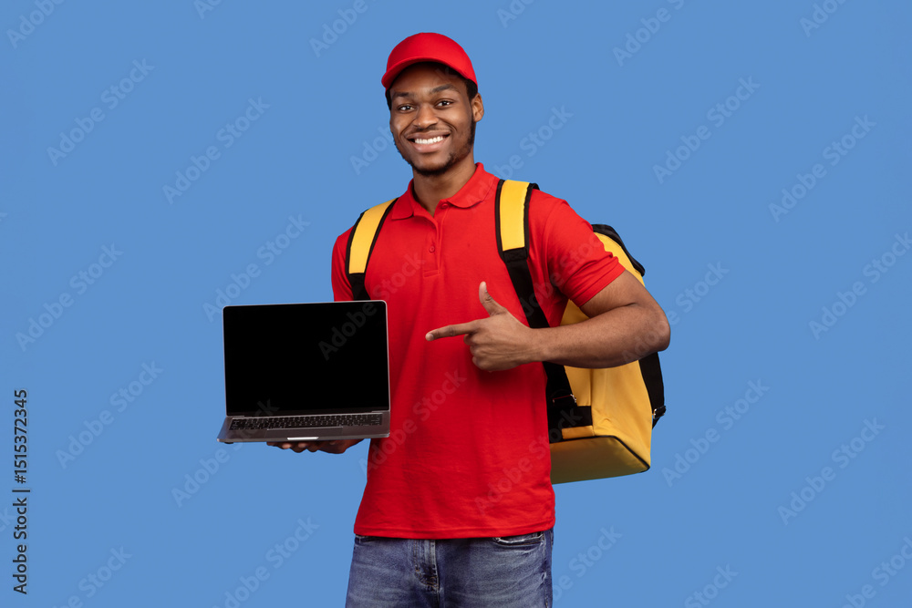 Poster order here. portrait of smiling black delivery man holding laptop and pointing at empty screen for m