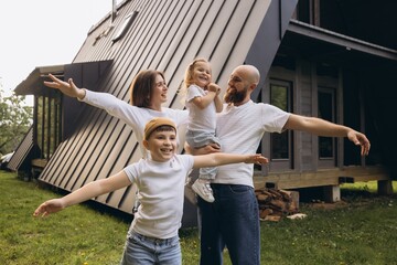 Happy family enjoying their new sustainable home