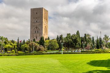 Hassan Tower ancient incomplete mosque minaret and green park in the foreground, Rabat, Morocco