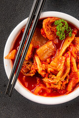 Kimchi pickled cabbage salad spicy savory vegetables fresh delicious gourmet food background on the table rustic food top view copy space vegetarian and vegan food