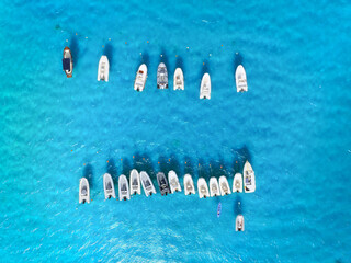 Drone view of a motorboats. Luxury transportation. Vacationing people. Azure water. Vacation and holidays. Summer time for sea travel.  Background, wallpaper, postcard.