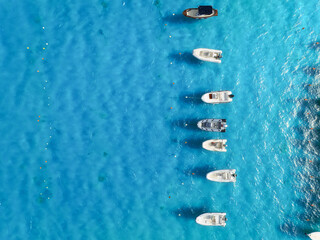 Drone view of a motorboats. Luxury transportation. Vacationing people. Azure water. Vacation and holidays. Summer time for sea travel.  Background, wallpaper, postcard.