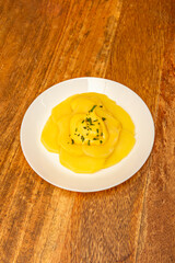 Papa a la huancaína: Boiled potatoes covered in a creamy sauce made from cheese and yellow chili, a classic of Peruvian cuisine 01