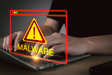 Anti Virus. user hand working on laptop computer with virtual malware attack warning graphic icon, virus protection software, cybersecurity, business finance, internet network technology concept