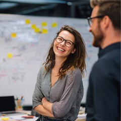A joyful moment of two people interacting in a professional environment