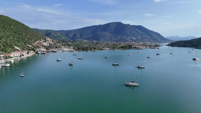 Aerial fly over of a Greek island sea inlet, natural sheltered bay, popular with tourist for sailing holidays.