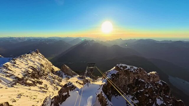 4K moving timelapse video with a paraglider near sunset or sundowner at Mount Zugspitze summit, top of germany, Garmisch, Partenkirchen, Werdenfelser Land, Bavaria, Germany