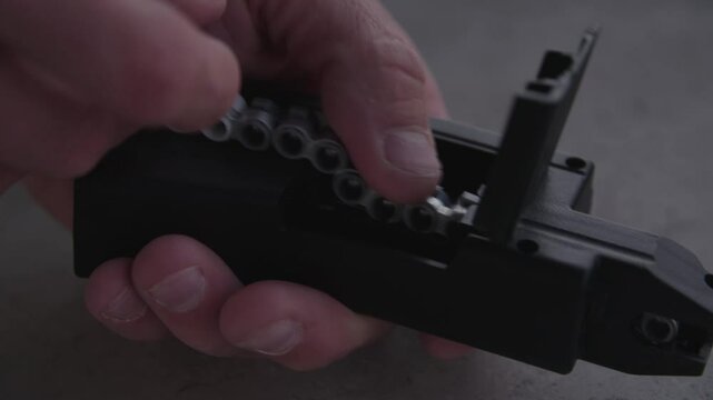 Close up of loading air gun bullet magazine