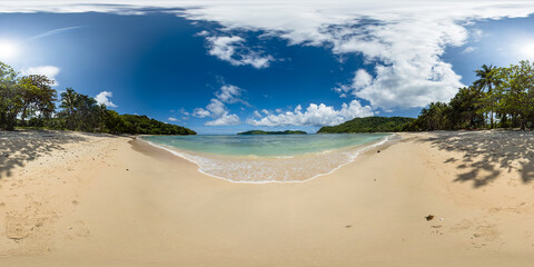 Tropical beach with transparent sea water and waves. Blue sky and clouds. El Nido. Palawan. Philippines. VR 360.