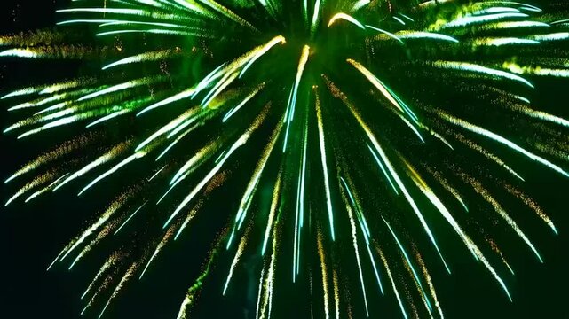 Green fireworks exploding against a transparent green screen (chroma key) background, perfect for overlaying in holiday or celebration-themed videos. Bright, festive bursts with glowing trails and par