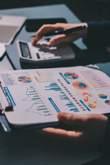 Expert woman asian female people review data number costing managerial account prepare monthly actual cost variance report at tax audit office. ESG sheet budget control ERP process service project.