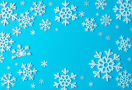 Intricate white paper snowflakes scattered on a vibrant blue background,  winter background,  macro