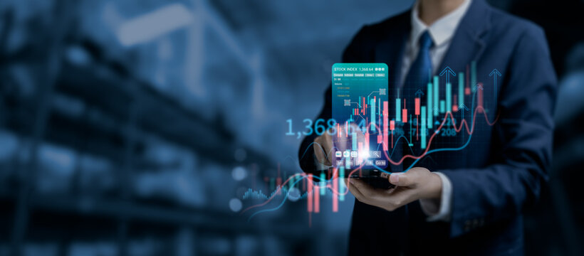 Businessman using smartphone with virtual stock market trading interface, financial technology, investment analysis and real-time trading graph, concept of mobile trading and fintech innovation.