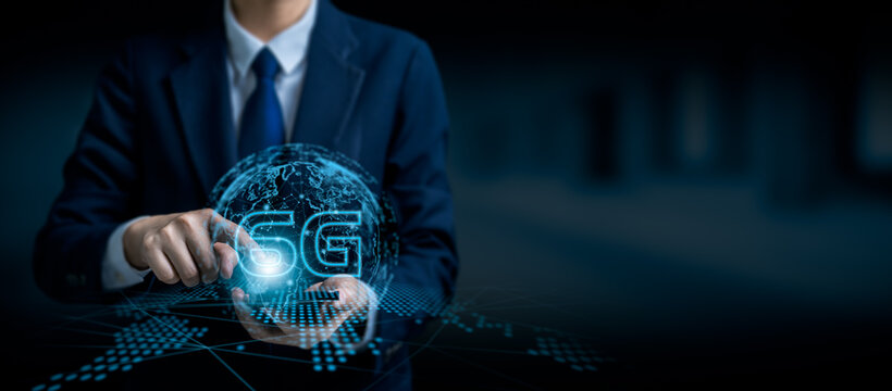 Businessman touching virtual 6G hologram with global network connection, high-speed wireless communication technology concept, future digital innovation and internet infrastructure development.